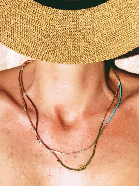 Handmade colorful necklace made with tiny glass Japanese beads. These are high-quality beads, very soft, and regular. The result is a light and smooth piece, easy to put on, as it doesn't come with a clasp.   You can wear it long and short, alone or layered with other necklaces for a trendy style, and it's also great wrapped around your wrist. 